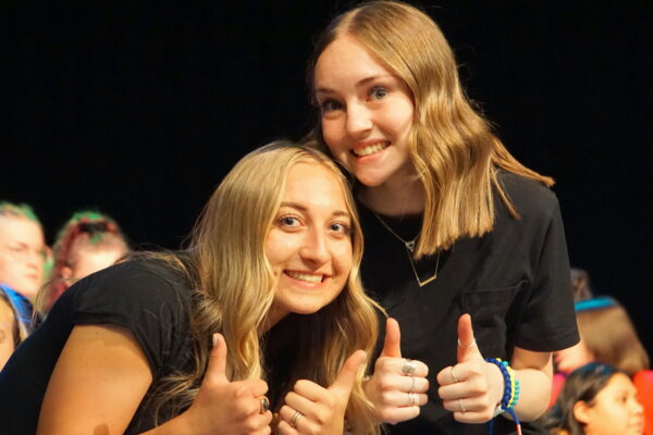 Kinley S. and Hannah D. give a thumbs up.