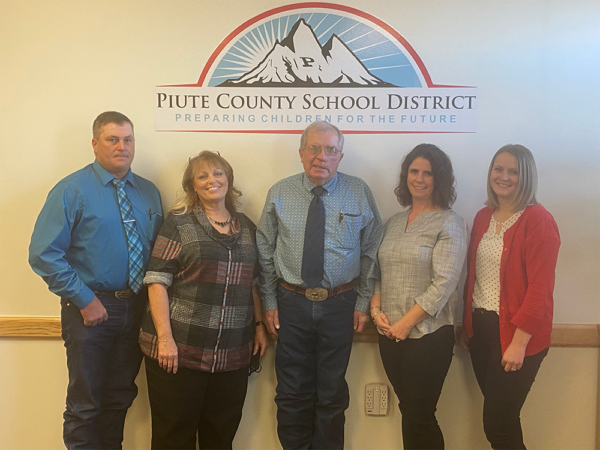 The 5 individuals on the piute school board pose for a picture