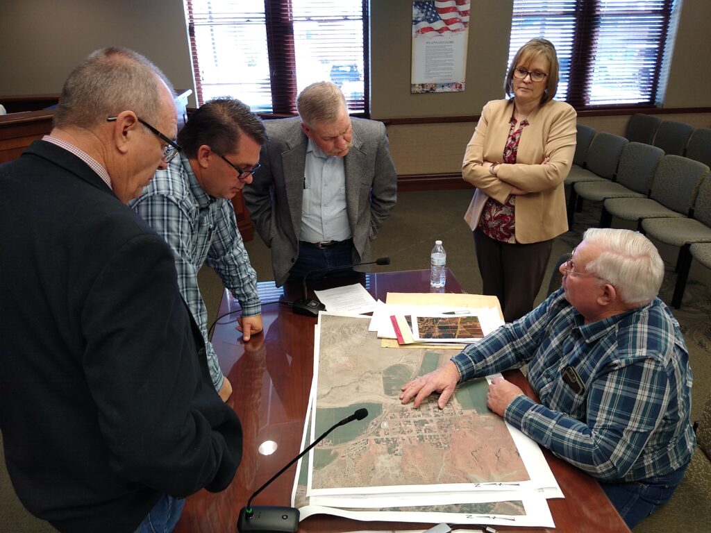 Commissioners look at a map of Cannonville.