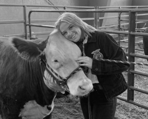 Ryley Veater and her cow at the Livestock Show