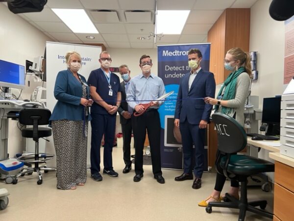 Six Intermountain employees pose during the ribbon cutting of the new GI Genius technology