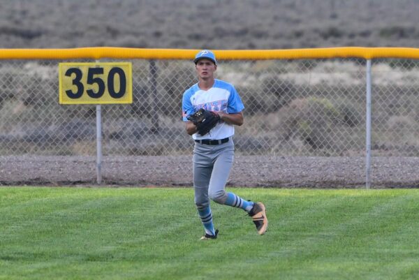 A Piute baseball player in the outfield.