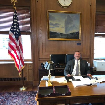 Eric Houston sitting at a desk.