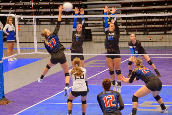 Rich's volleyball team blocks a hit from Panguitch's team.