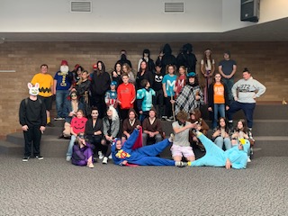 A number of Escalante students pose with their costumes. There is a Charlie Brown, a Jack-O-Lantern, a super hero, and many others!