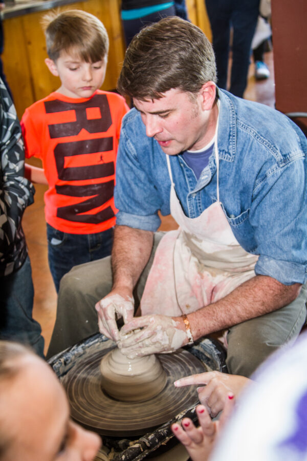 man doing pottery