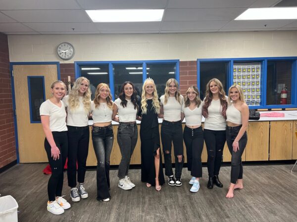 Panguitch girls posing for a picture before they go in to compete at the Homecoming Queen Contest.