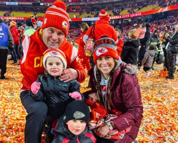 Porter Ellett, his wife, and his two kids celebrating the Chiefs' win.