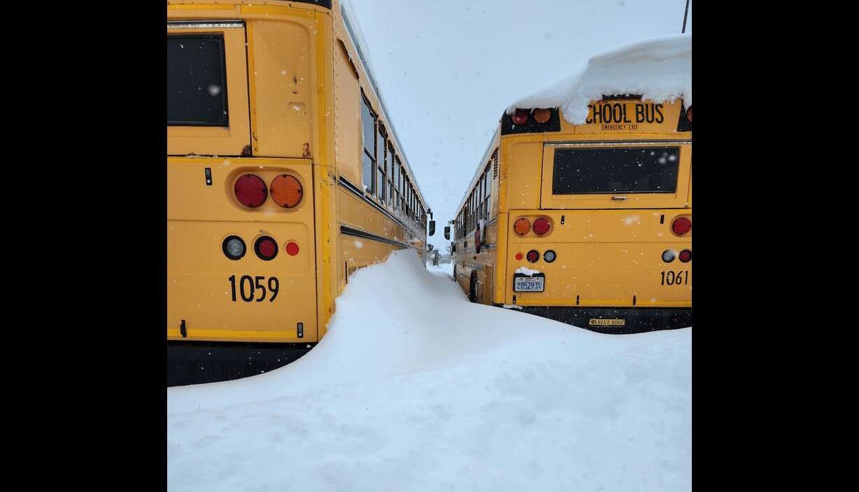 Tooele school buses buried in snow.