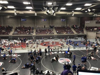 Wrestlers warm up on the mats at State wrestling at the Sevier Valley Center.