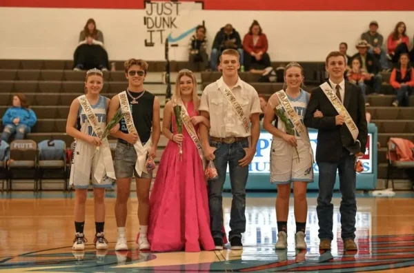 Homecoming Royalty (three couples) are crowned on the basketball court.