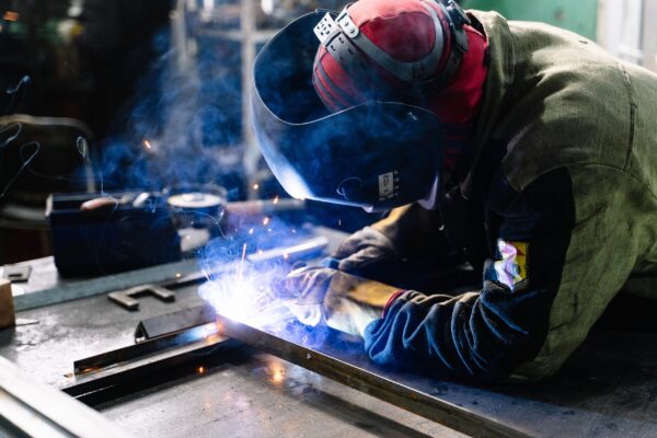 A man doing soldering.