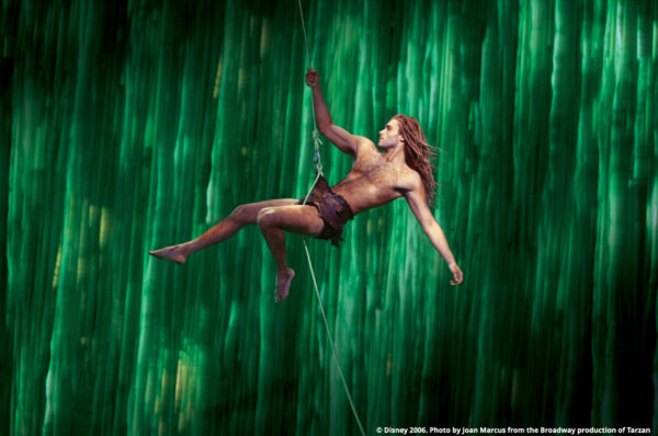 Josh Strickland, as Tarzan, swings across the Tuacahn stage.