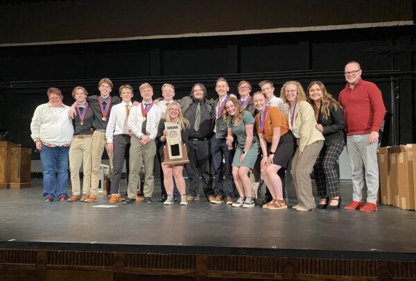 Bryce Valley speech and debate team poses with their first place trophy.