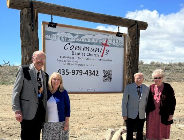 The Edwardses and Inneses next to the Community Baptist Church in Tropic.