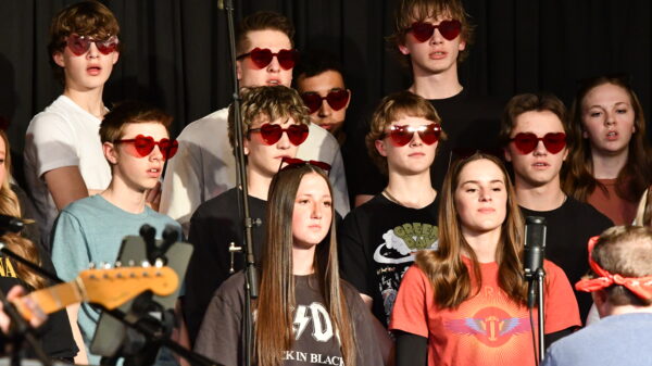 Piute's choir wearing heart glasses.