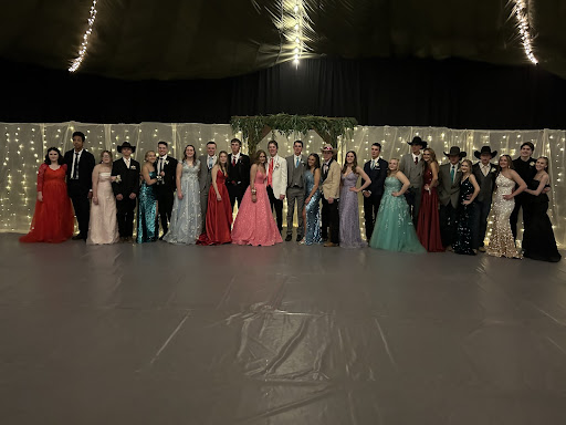 Piute's juniors pose in their dresses and tuxedos at Prom.