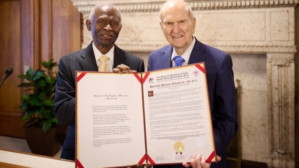 President Nelson and Reverend Carter pose with the Ghandi-King-Mandela Peace Prize.