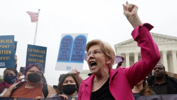Senator Elizabeth Warren (D-MA) yelled to protesters outside the U.S. Supreme Court, shortly after a draft opinion overturning Roe v. Wade was leaked in May, 2022.
