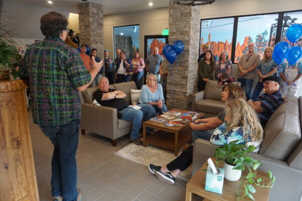 Rogar Kaspar talks to a group in the Two Sunsets lobby.