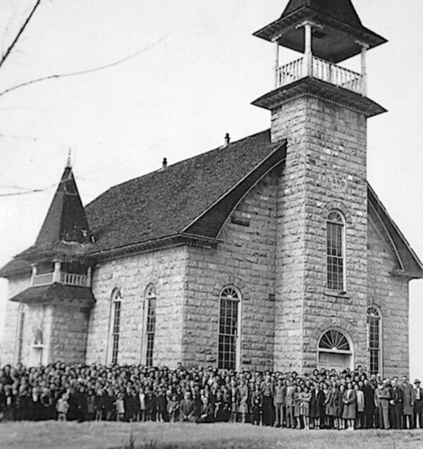 A congregation in front of a large LDS in the late 1800s.