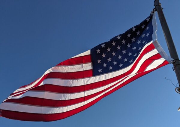 The American Flag flying in the wind.