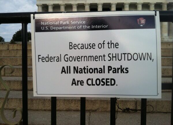 A sign reading, "Because of the Federal Government SHUTDOWN, All National Parks Are CLOSED."