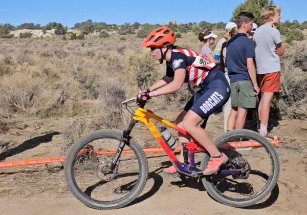 Zoey Fawson races along the course on her mountain bike.