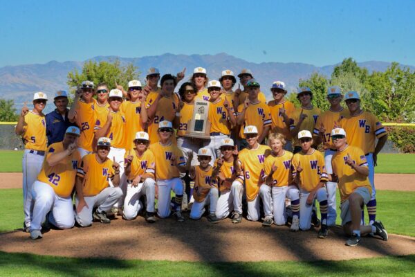 The Wayne baseball team takes a picture with their 2023 1A State Baseball Championship trophy.