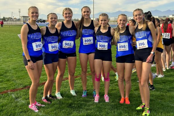 The seven Panguitch cross country runners on the team at state pose for a picture.