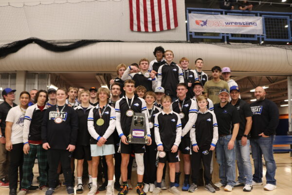 The Panguitch wrestling team shows off their 2024 divisionals trophy in a group photo.