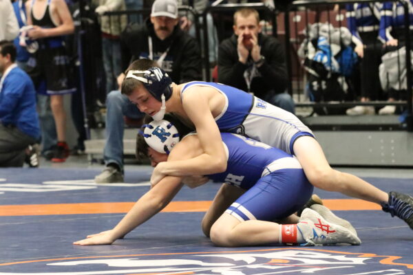 Lincoln Henrie from Panguitch tries to pull the arms out from under a wrestler from Rich.
