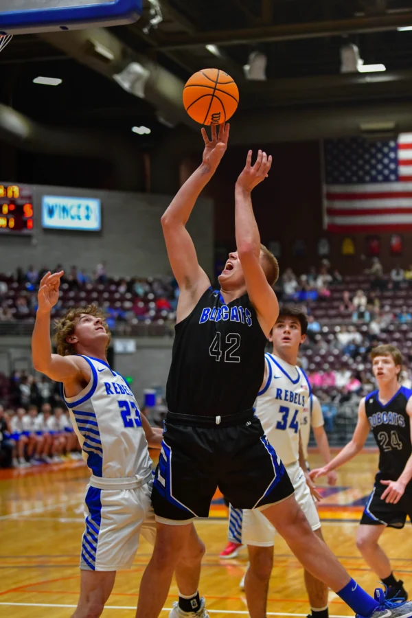 A tall Panguitch boys basketball player goes for a layup.