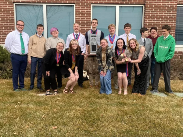 Group picture of Bryce Valley's debate team with their state trophy.