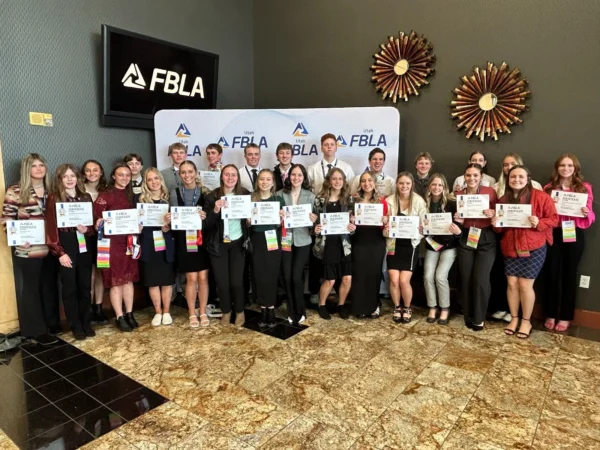 Piute's 26 FBLA students at state FBLA, holding up certificates they each won.