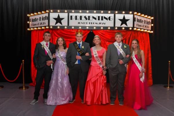 Piute's junior prom court with their Hollywood curtains and red carpet backdrop.