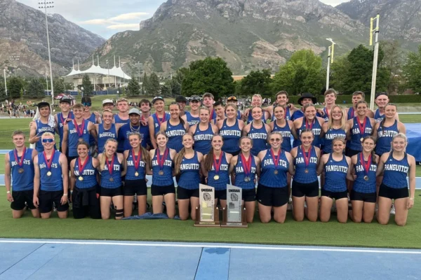 Panguitch's boys and girls track teams with their state trophies at BYU's track.