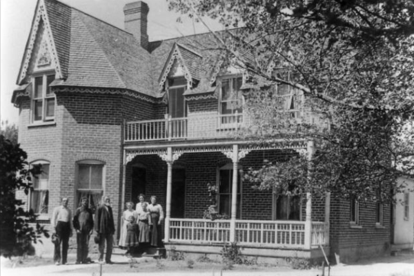 A black and white picture of the old Morrill House when the Morrills were living in it.