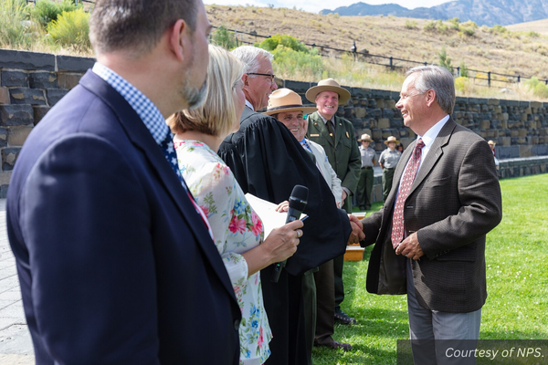 Tom Branson shakes the hand of the U.S. Magistrate at his naturalization ceremony. Courtesy of NPS.