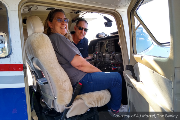 Jaime Catlett in the front seat of a small Civil Air Patrol plane with Don Lien. Courtesy of AJ Martel, The Byway.