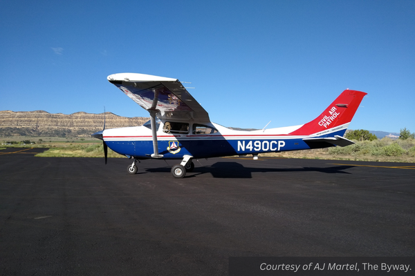 A small Civil Air Patrol plane, with red and blue stripes. Courtesy of AJ Martel, The Byway.