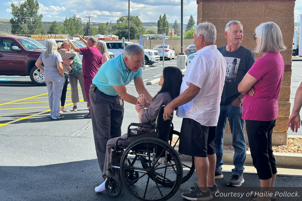 Dr. Birch greets Nancy Houston, who sits in a wheelchair. Courtesy of Hailie Pollock.