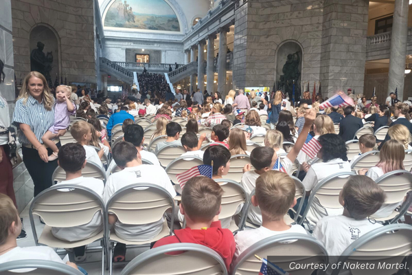 Fifth and sixth graders sitting in an assembly at the Utah State Capitol building. Courtesy of Naketa Martel.