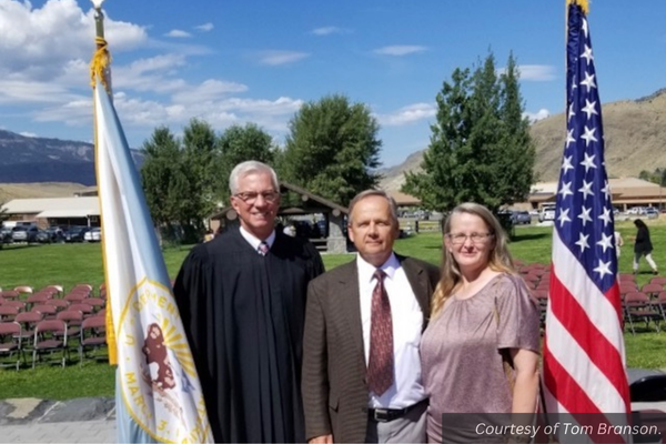 Tom Branson and his wife, Rebecca, with U.S. Magistrate Judge Mark L. Carman.