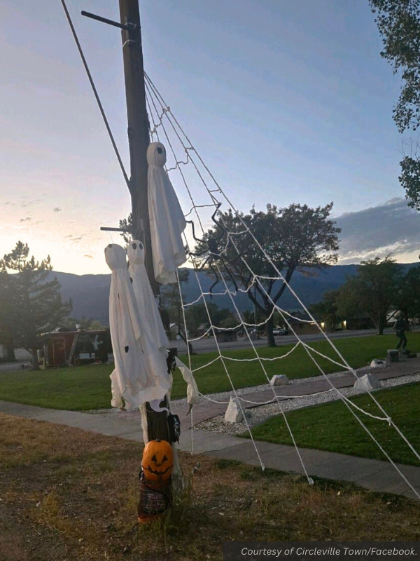 Ghosts made out of sheets and a spiderweb made from a long rope gridwork decorate a pole on Circleville Main Street. Courtesy of Circleville Town/Facebook.