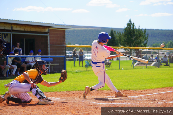 Panguitch number 0 hits the baseball at a home game against Wayne. Courtesy of AJ Martel, The Byway.