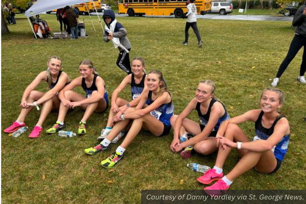 The Panguitch girls cross country team sitting on the grass at the state meet. Courtesy of Danny Yardley via St. George News.