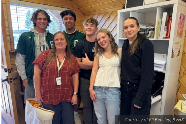 The Bryce Valley High School executive council giving a gift to Mrs. Teresa Deccio. Courtesy of Eli Beesley, BVHS.