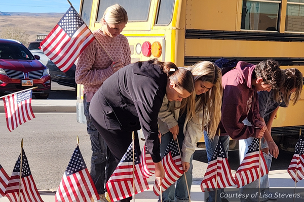 Wayne students placing American flags on the school lawn. Courtesy of Lisa Stevens.