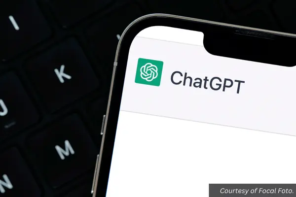 The corner of a smart phone showing the ChatGPT logo on the screen. Courtesy of Focal Foto.